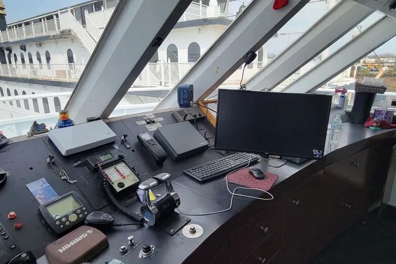 Slide: The Image of 1978 Blount Passenger ship bridge with navigation equipment and computer setup. - 17
