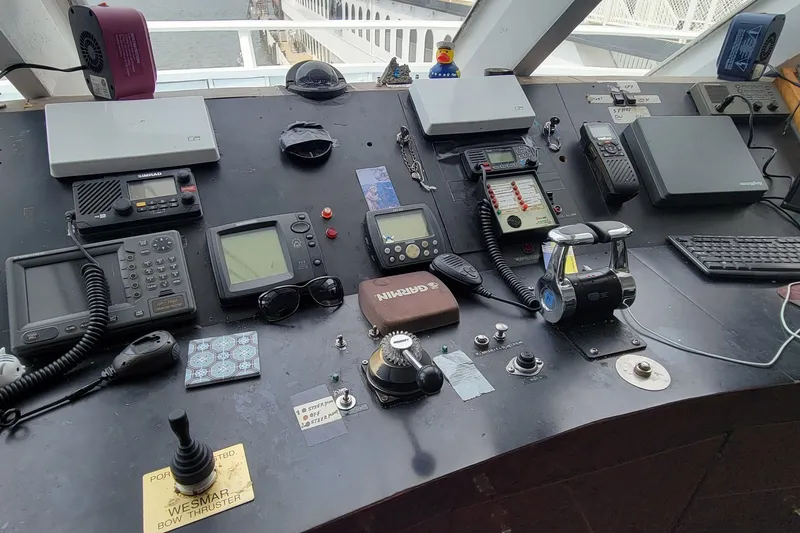 Slide: The Image of Control panel of a 1978 Blount Passenger vessel with navigation and communication equipment. - 16