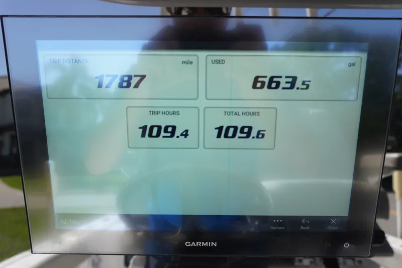 Slide: The Image of Display screen on 2024 Sportsman Masters 267OE Bay Boat showing trip data and fuel usage. - 34
