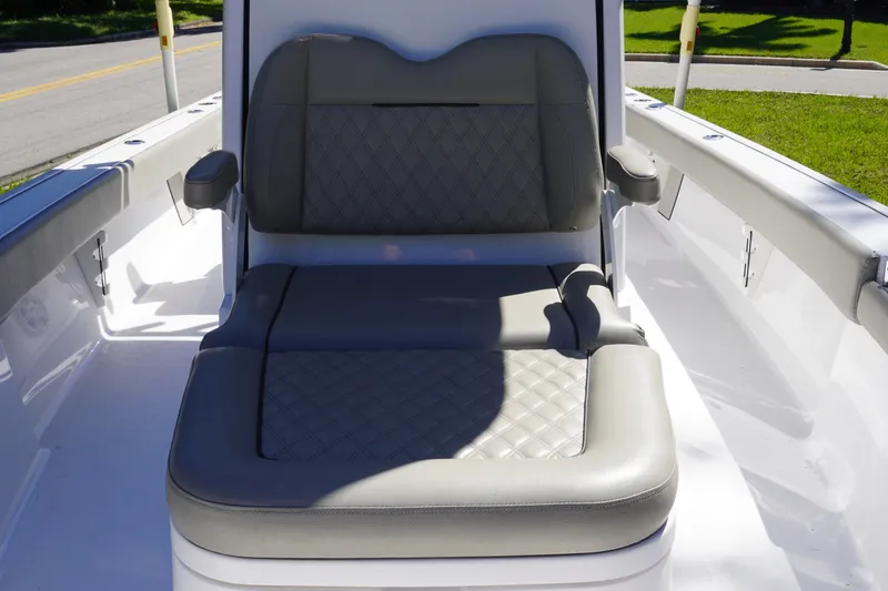 Slide: The Image of 2024 Sportsman Masters 267OE Bay Boat with cushioned seating and armrests. - 45