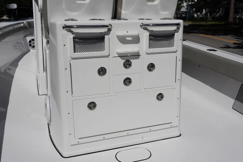 Slide: The Image of 2024 Sportsman Masters 267OE Bay Boat console with storage compartments and sleek design. - 25
