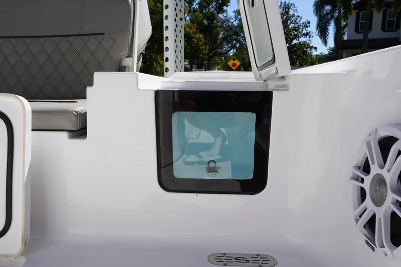Slide: The Image of 2024 Sportsman Masters 267OE Bay Boat interior with seating and speaker detail. - 18