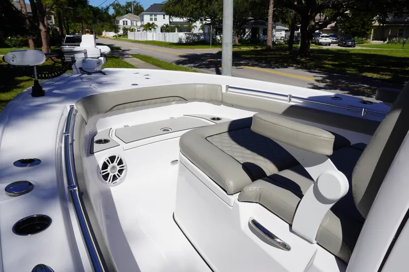 Slide: The Image of 2024 Sportsman Masters 267OE Bay Boat interior with cushioned seating and speaker system. - 37