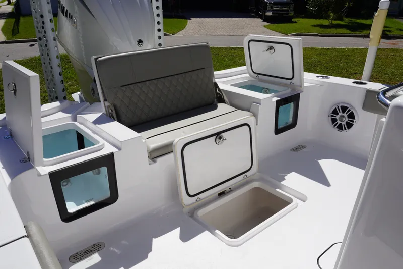 Slide: The Image of 2024 Sportsman Masters 267OE Bay Boat interior with storage compartments and seating. - 15