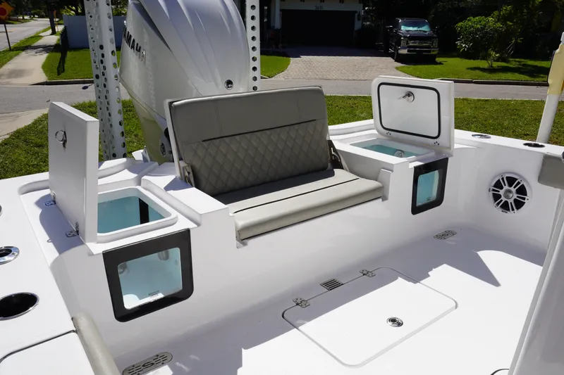 Slide: The Image of 2024 Sportsman Masters 267OE Bay Boat interior with seating and storage compartments. - 14
