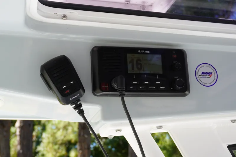 Slide: The Image of Garmin radio system on 2024 Sportsman Masters 267OE Bay Boat dashboard. - 31