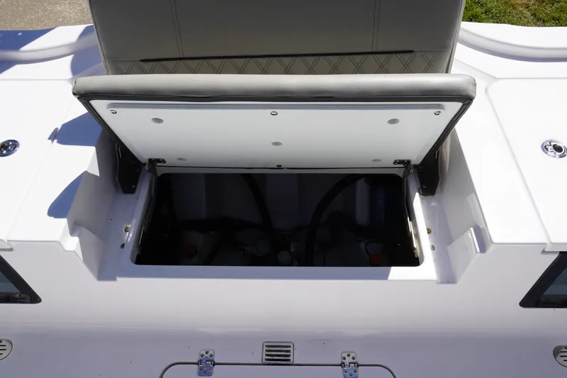 Slide: The Image of Open storage compartment on 2024 Sportsman Masters 267OE Bay Boat, showcasing interior space. - 22
