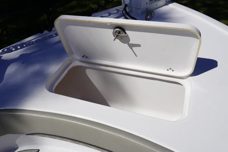 Slide: The Image of 2024 Sportsman Masters 267OE Bay Boat storage compartment with open hatch. - 40
