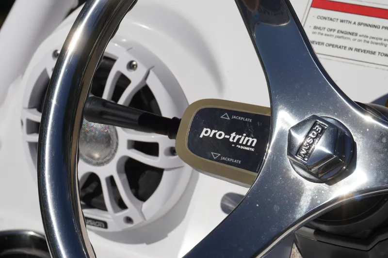 Slide: The Image of Steering wheel and controls of 2024 Sportsman Masters 267OE Bay Boat. - 51