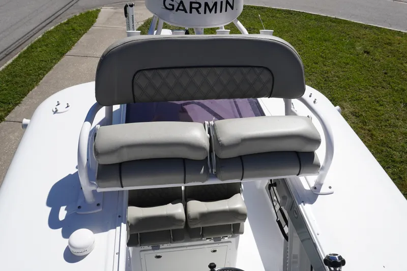 Slide: The Image of 2024 Sportsman Masters 267OE Bay Boat helm seating with Garmin equipment. - 49