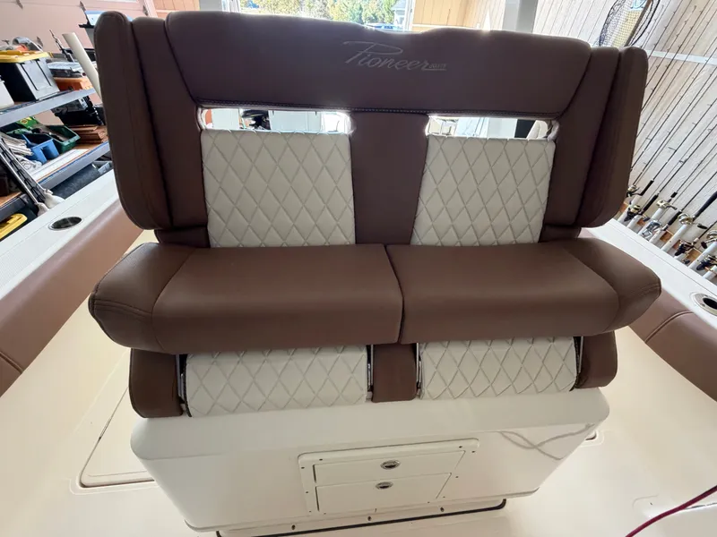 Slide: The Image of The 2022 Pioneer 270 Pelagic features a luxurious, cushioned bench seat with a quilted design. - 23