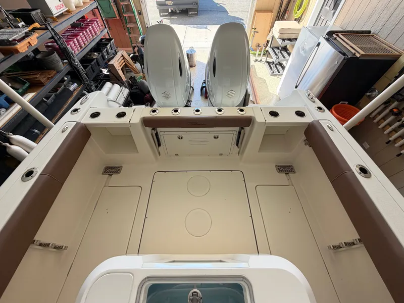 Slide: The Image of The image shows the cockpit of a 2022 Pioneer 270 Pelagic with seating and storage. - 30