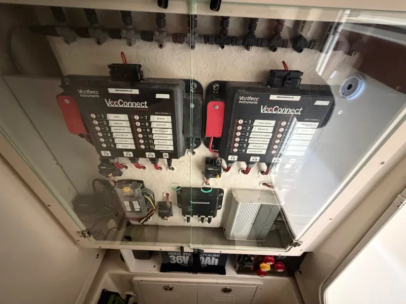 Slide: The Image of Electrical panel setup in a boat, featuring VeeConnect systems and various switches and wiring. - 17