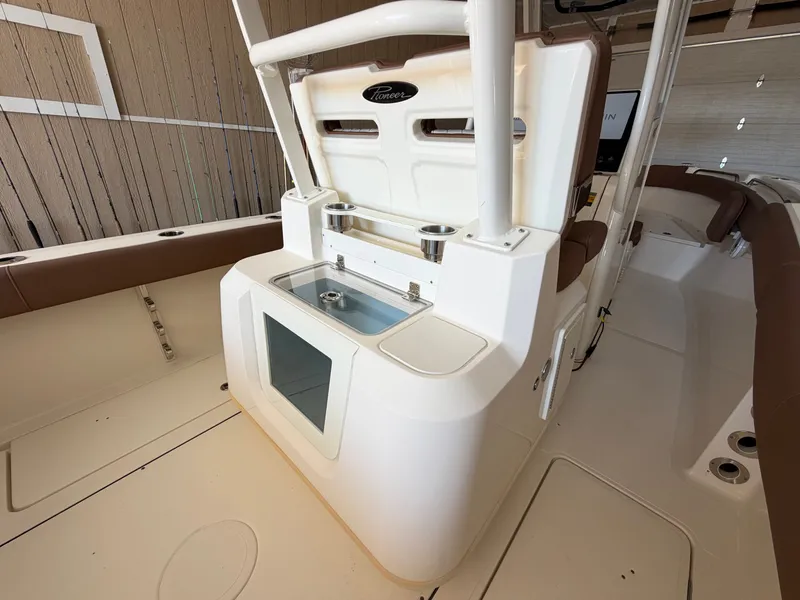 Slide: The Image of The image shows the cockpit of a 2022 Pioneer 270 Pelagic with a central helm station. - 28
