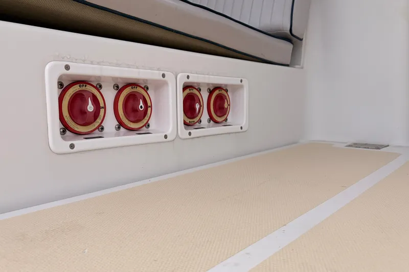 Slide: The Image of Battery switches on a 2001 Mainship Pilot 34 boat interior. - 45