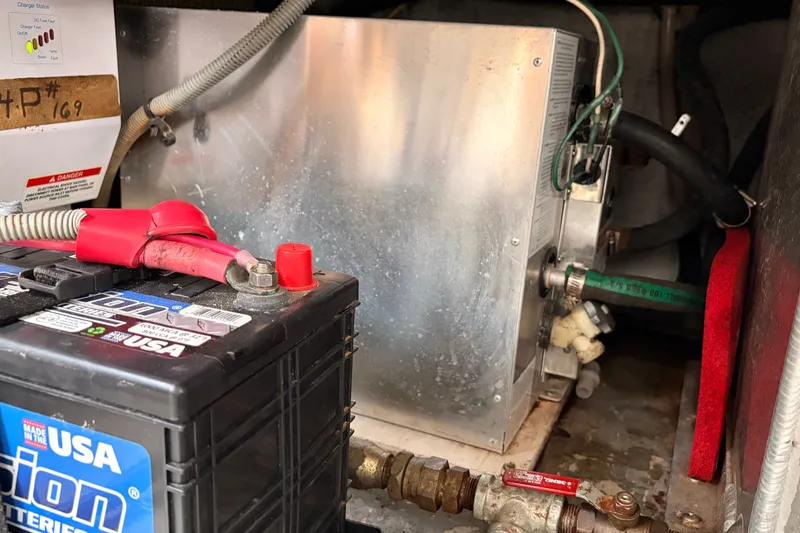 Slide: The Image of Battery and engine compartment of a 2001 Mainship Pilot 34 boat. - 44