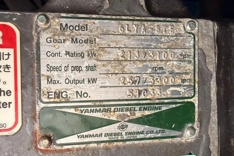Slide: The Image of Yanmar diesel engine plate with specifications for a 2001 Mainship Pilot 34. - 41