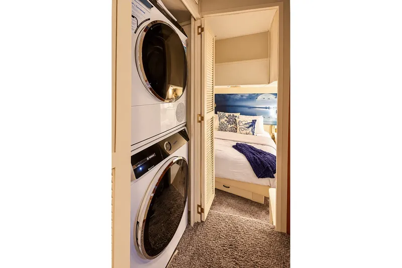 Slide: The Image of Laundry area and cozy bedroom in 1991 Tollycraft 61 Pilothouse Motor Yacht. - 35