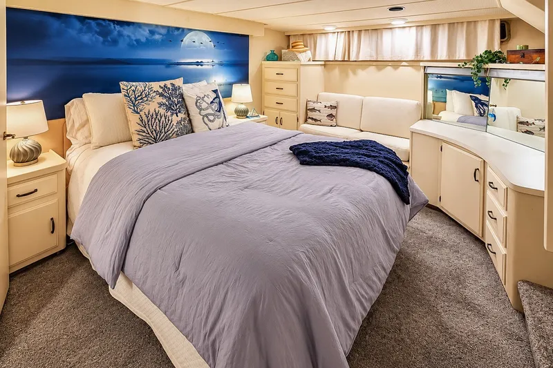 Slide: The Image of Luxurious bedroom in 1991 Tollycraft 61 Pilothouse Motor Yacht with elegant decor and cozy bedding. - 27