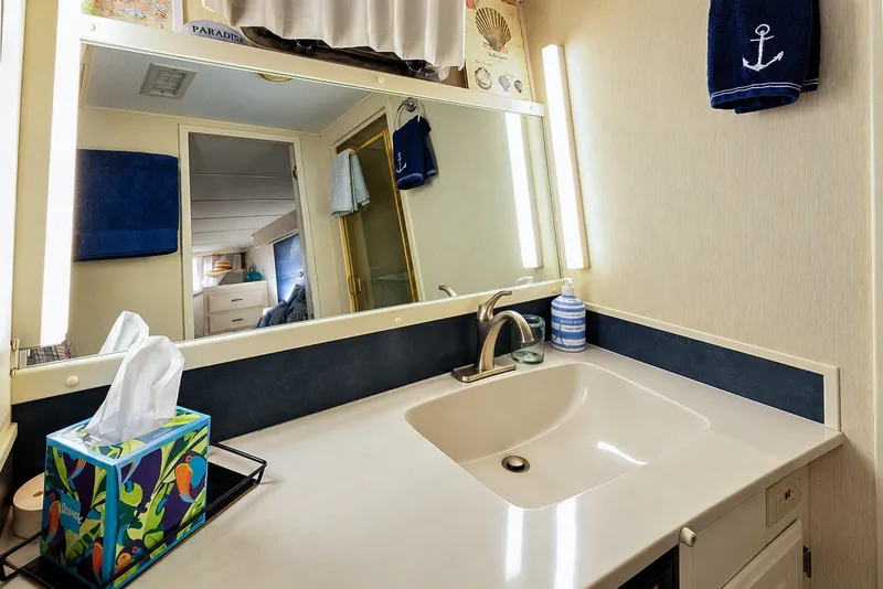 Slide: The Image of Bathroom vanity in 1991 Tollycraft 61 Pilothouse Motor Yacht with nautical decor. - 33