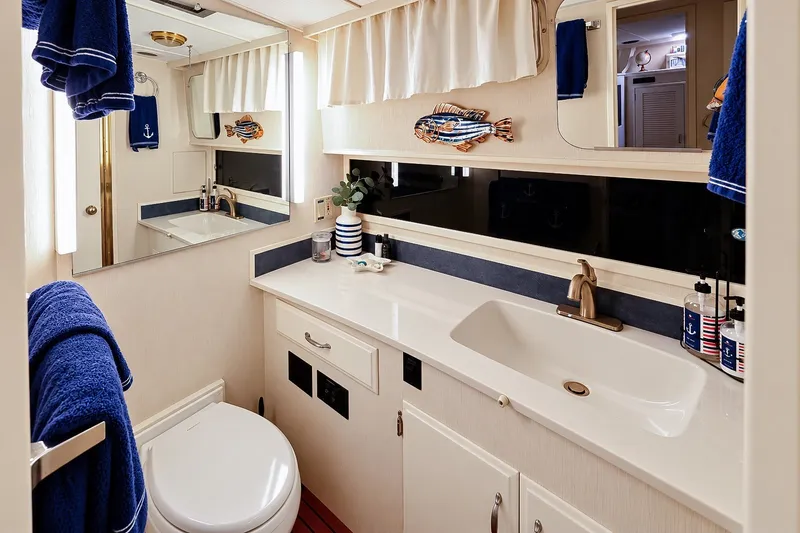 Slide: The Image of Bathroom interior of 1991 Tollycraft 61 Pilothouse Motor Yacht, featuring nautical decor. - 40
