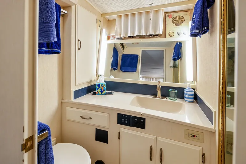 Slide: The Image of Bathroom interior of 1991 Tollycraft 61 Pilothouse Motor Yacht with sink and mirror. - 32