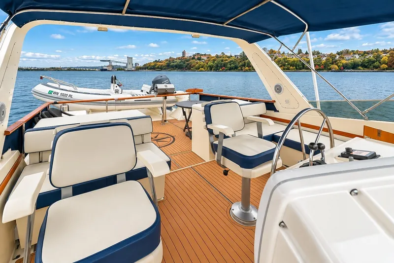 Slide: The Image of 1991 Tollycraft 61 Pilothouse Motor Yacht with spacious deck and scenic water view. - 48