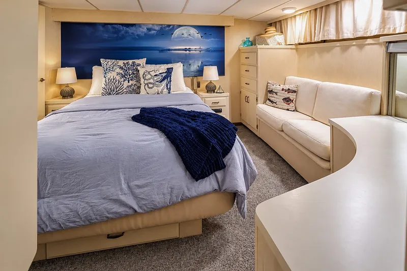 Slide: The Image of Luxurious bedroom in 1991 Tollycraft 61 Pilothouse Motor Yacht with elegant decor and cozy furnishings. - 28