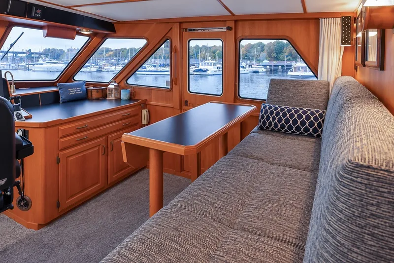 Slide: The Image of Luxurious interior of 1991 Tollycraft 61 Pilothouse Motor Yacht with scenic marina view. - 23