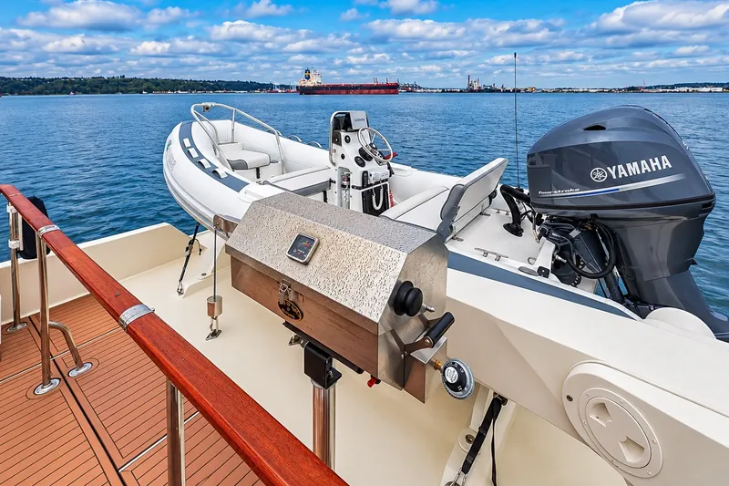 Slide: The Image of 1991 Tollycraft 61 Pilothouse Motor Yacht deck with grill and Yamaha motor. - 51