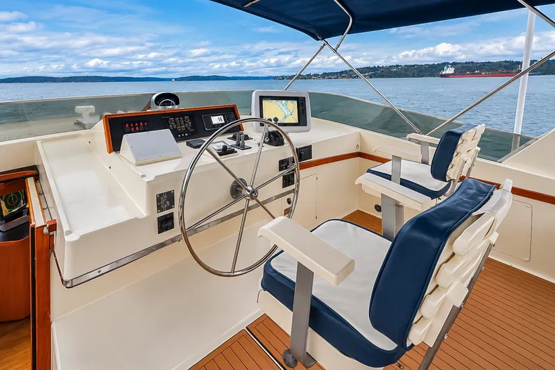 Slide: The Image of Pilothouse of 1991 Tollycraft 61 Motor Yacht with steering wheel and navigation equipment. - 52