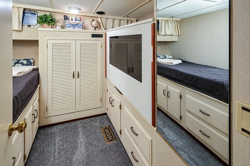 Slide: The Image of Interior of 1991 Tollycraft 61 Pilothouse Motor Yacht with cozy cabin and storage. - 45