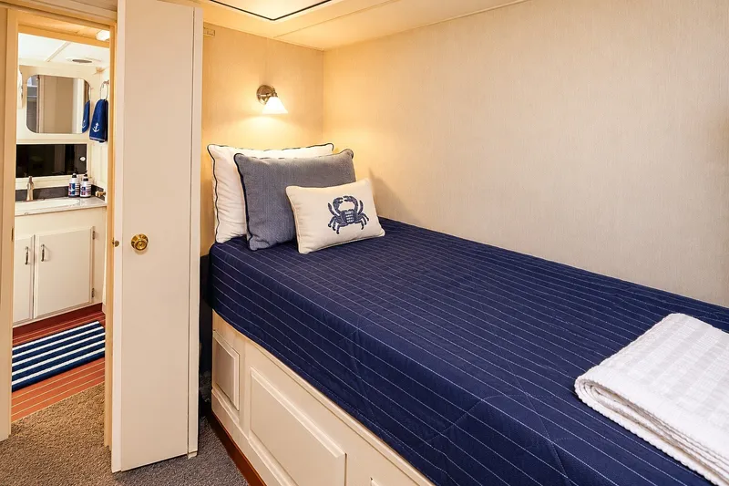 Slide: The Image of Cozy cabin interior of 1991 Tollycraft 61 Pilothouse Motor Yacht with nautical decor. - 44