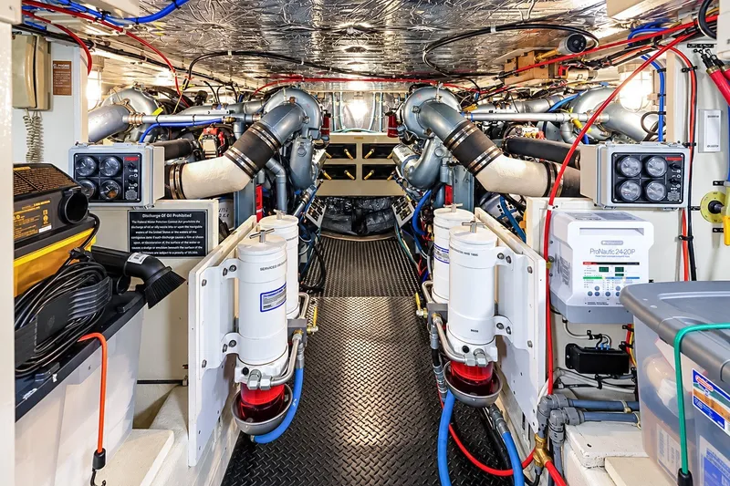 Slide: The Image of Engine room of 1991 Tollycraft 61 Pilothouse Motor Yacht, showcasing machinery and equipment. - 57