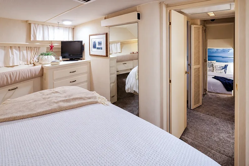 Slide: The Image of Luxurious interior of 1991 Tollycraft 61 Pilothouse Motor Yacht bedroom suite. - 38