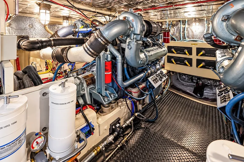 Slide: The Image of Engine room of 1991 Tollycraft 61 Pilothouse Motor Yacht, showcasing detailed machinery. - 58
