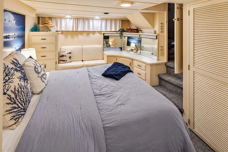 Slide: The Image of Luxurious bedroom interior of 1991 Tollycraft 61 Pilothouse Motor Yacht with elegant decor. - 30