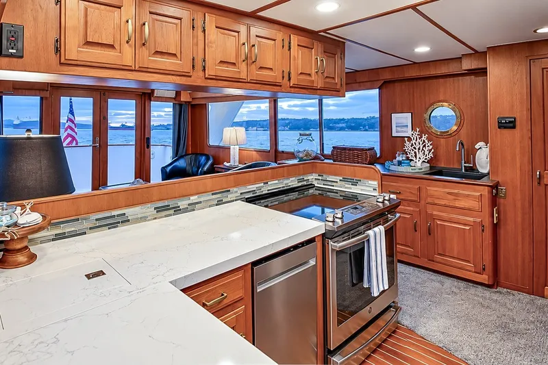Slide: The Image of Luxurious kitchen interior of 1991 Tollycraft 61 Pilothouse Motor Yacht with ocean view. - 19