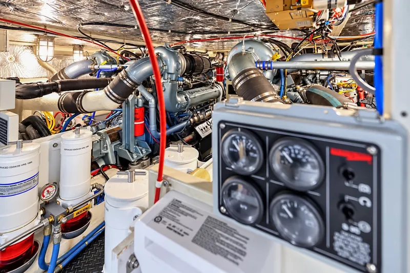 Slide: The Image of Engine room of 1991 Tollycraft 61 Pilothouse Motor Yacht with gauges and machinery. - 59