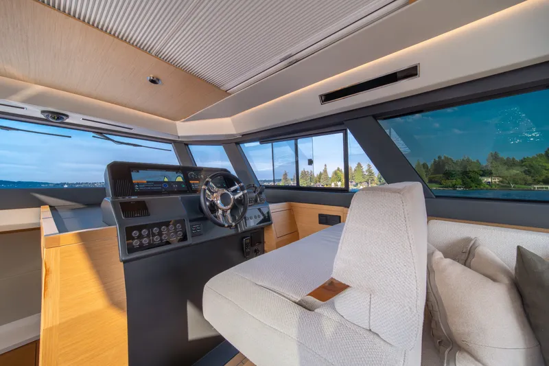 Slide: The Image of 2023 Pardo Yachts GT52 helm with modern controls and panoramic windows. - 27
