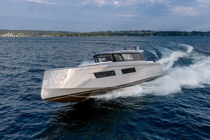 Slide: The Image of 2023 Pardo Yachts GT52 cruising on open water under a cloudy sky. - 1