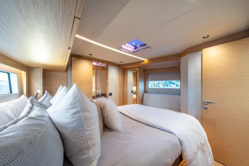 Slide: The Image of Luxurious bedroom interior of 2023 Pardo Yachts GT52, featuring elegant design and cozy bedding. - 33