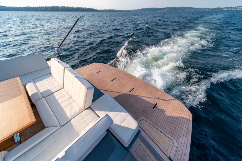 Slide: The Image of Luxurious 2023 Pardo Yachts GT52 cruising on open water with elegant seating area. - 13