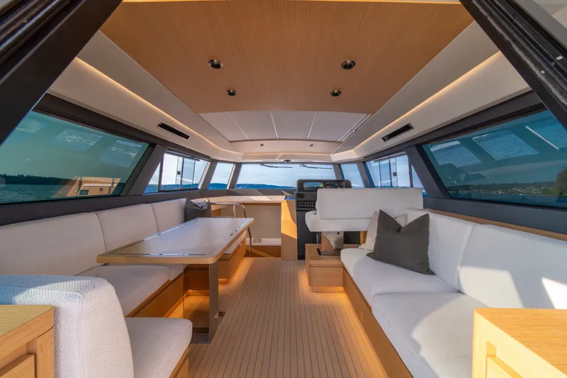 Slide: The Image of Luxurious interior of 2023 Pardo Yachts GT52 with elegant seating and panoramic windows. - 21