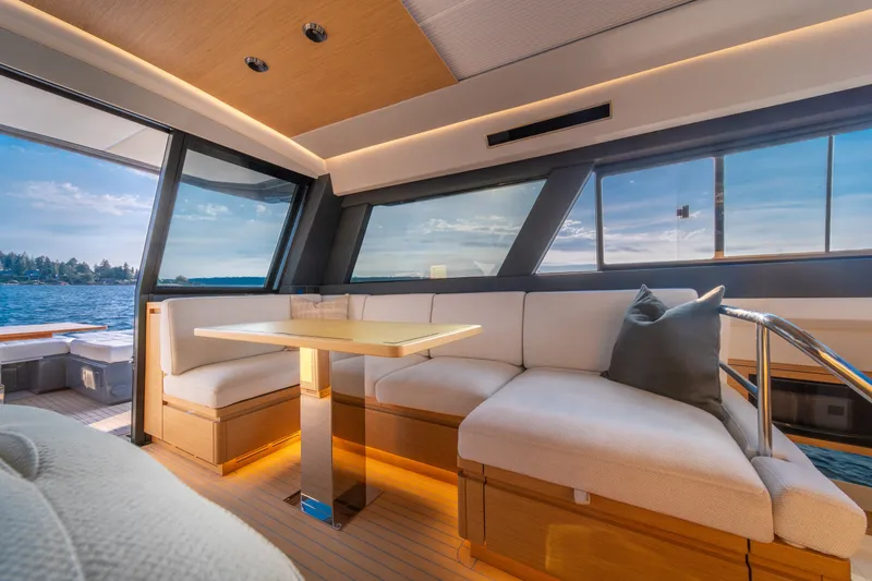 Slide: The Image of Luxurious interior of 2023 Pardo Yachts GT52 with elegant seating and scenic ocean view. - 23