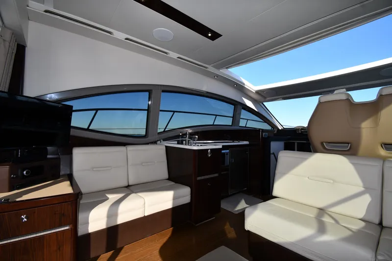 Slide: The Image of Luxurious interior of 2017 Sea Ray Sundancer 400 yacht with modern seating and panoramic windows. - 33