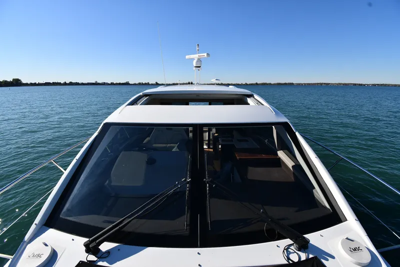 Slide: The Image of 2017 Sea Ray Sundancer 400 yacht cruising on calm blue waters. - 6