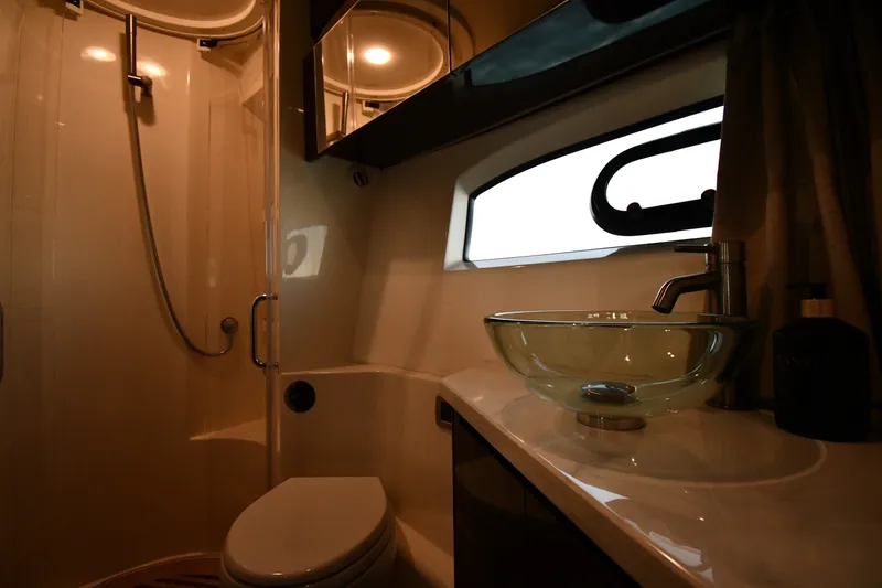 Slide: The Image of Luxurious bathroom in 2017 Sea Ray Sundancer 400 yacht with glass sink and shower. - 24