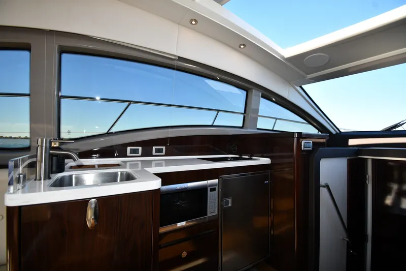 Slide: The Image of Luxurious interior of 2017 Sea Ray Sundancer 400 yacht with modern kitchen amenities. - 35