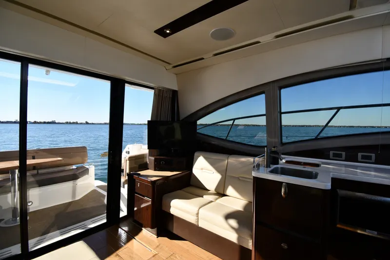 Slide: The Image of Interior of 2017 Sea Ray Sundancer 400 yacht with lake view through large windows. - 34